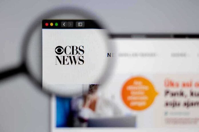 Magnifying glass focusing on CBS News logo on a website