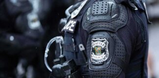 Close-up of a police officer's uniform with a Seattle Police patch