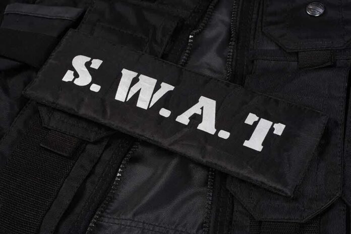 Close-up of a SWAT uniform patch on black tactical gear