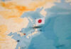 Map of Japan with flag pin placed nearby