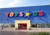 Exterior view of a Toys R Us store with colorful signage