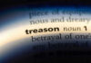 Ex-U.S. Ambassador CAUGHT Spying—BETRAYS America! The word treason highlighted in a dictionary.
