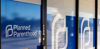 Planned Parenthood office entrance with logo and signs.