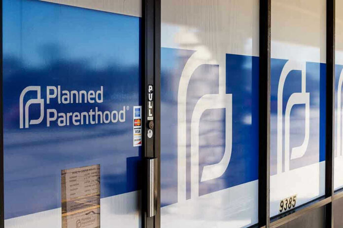 Planned Parenthood office entrance with logo and signs.