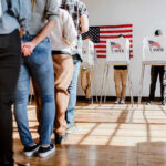 Trump-Backed Candidate OUSTS LONG-TIME Incumbent People in line at voting booths.