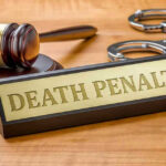 DC Terror Rampage: Death Penalty Looms! Gavel, handcuffs, and Death Penalty sign on desk.