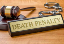 DC Terror Rampage: Death Penalty Looms! Gavel, handcuffs, and Death Penalty sign on desk.