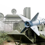 American Tech Fuels Russia’s War Machine Military missile launcher with radar systems in a foggy field.