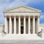 35 Judges AMBUSH the Case: Fraud Allegations! Front view of the Supreme Court building with large columns and steps under a blue sky