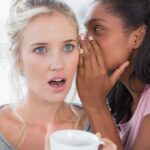 Hunter’s SHOCKING Confession — WHY NOW? Two women in a casual setting, one whispering to the other who looks surprised