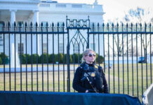 DOJ Drops “Terror Plot” Images—Questions Explode Secret Service agent stands guard outside the White House.