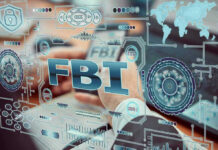 Cartoonist Pulled Into Bizarre FBI Probe FBI text surrounded by digital security graphics and hands