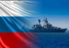 Putin’s Nuclear Sea Giant Is Back in the Arctic Warship overlaid with the Russian flag.