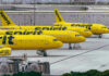 Airline Shake-Up: Prices Quietly Surge Yellow airplanes parked on the airport tarmac.