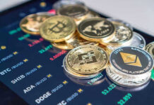 Cryptocurrency coins on a trading screen background.