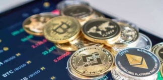 Cryptocurrency coins on a trading screen background.