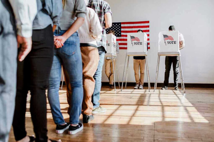 2007687677 People in line at voting booths.