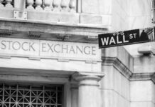 Inside Trump’s 3,700 Trades: Outrage vs. Evidence Stock Exchange building and Wall Street sign.