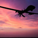 Gospel-Named Tool, Ominous Targets Silhouette of a drone against a colorful sunset.
