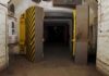 Missile Tunnels Reopen Fast After Strikes Entrance to an underground bunker with large heavy doors and a sign