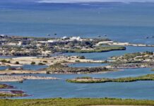 Albania Protests Erupt Over Trump-Linked Resort Plan Aerial view of a coastal landscape featuring waterways and islands