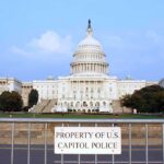 Trump’s Iran War: White House Refuses to Back Down View of the U.S. Capitol building with a security barrier in front