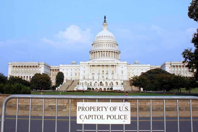 shutterstock_1913280-3 View of the U.S. Capitol building with a security barrier in front