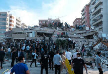 Ukraine’s Air Defenses Tested as Russia Launches Devastating Strike People at a collapsed building after an earthquake.