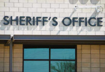 Massachusetts Sheriff Frees Gun Suspect Sheriffs Office sign on brick building faade.