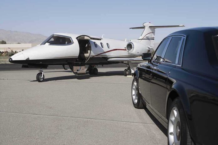 Limousine,And,Private,Jet,On,Landing,Strip A private jet parked at an airport with a luxury car in the foreground