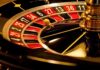 Close-up of a roulette wheel with a spinning ball
