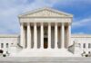 Fears of Pregnancy Checks at the U.S. Border Front view of the Supreme Court building with large columns and steps under a blue sky