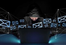 Cyberattack Disrupts Suisun City’s 911 System Hooded person using a laptop surrounded by email icons