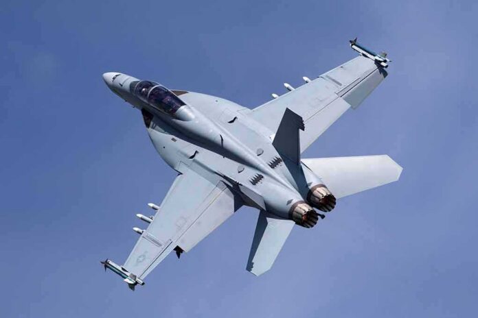 Fighter jet banking in clear sky