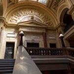 Grand courthouse interior with domed ceiling and staircase