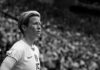 soccer player in jersey looks ahead during match