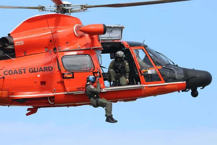Rescue helicopter with crew performing hoist operation