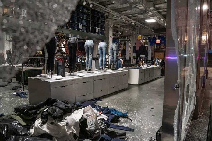 shutterstock_1747500071 clothing store interior with broken glass and scattered garments