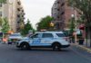 Woman Stabbed in Upper East Side Co-op as Suspect Is Detained NYPD police SUV blocking a city street at a taped-off scene