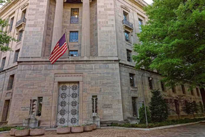 Stone government building with American flag at entrance