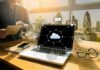 Fake ‘Made in USA’ Bombshell Laptop on desk showing cloud network icons