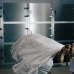 Body on a morgue gurney with toe tag