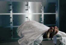 50+ Decomposing Bodies Found at Chicago Funeral Home Body on a morgue gurney with toe tag