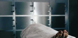 Body on a morgue gurney with toe tag