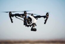Drones Raise Fresh Alarm Across Europe Quadcopter drone with camera flying outdoors
