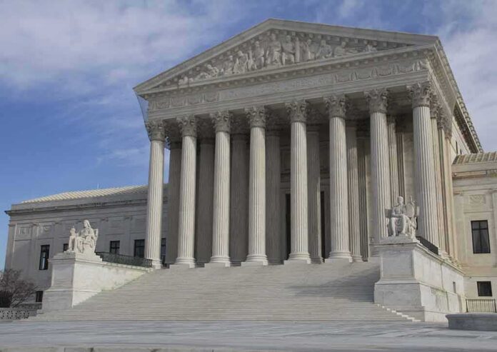 shutterstock_92660524-1 Supreme Court building with grand columns and steps