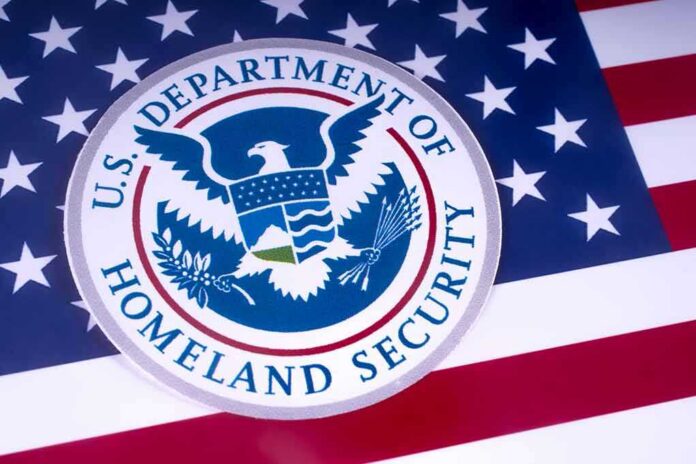 shutterstock_1051372529-1 U.S. Department of Homeland Security emblem on American flag