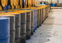 Rising Gas Prices Raise Midterm Concerns Rows of industrial metal barrels with yellow lids