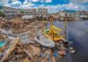 Nor’easter Turns Deadly in New York Coastal town marina destroyed by storm with debris and damaged boats