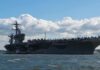 Aircraft carrier at sea with fighter jets on deck